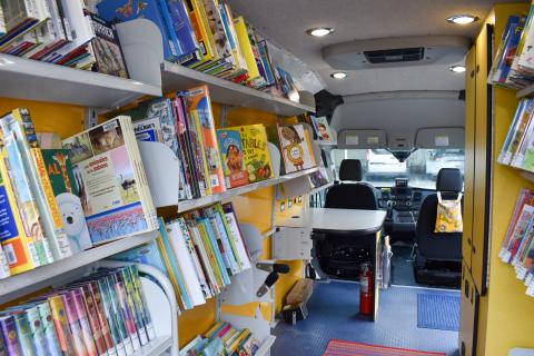 View inside Evie, the Mobile Library, of books on the shelves